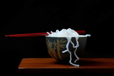 Shirataki noodles made from konjac flour in a bowl with chopsticks