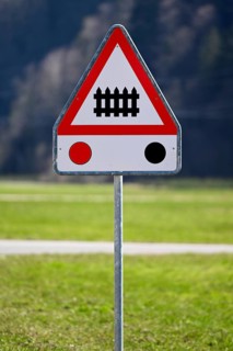 Traffic sign level crossing with barriers and traffic lights