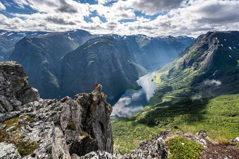 Hiker standing on rocky outcrop