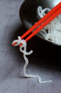 Shirataki noodles made from konjac flour in a bowl with chopsticks