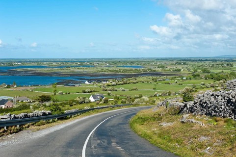 Lonely country road through the karst landscape of The Burren