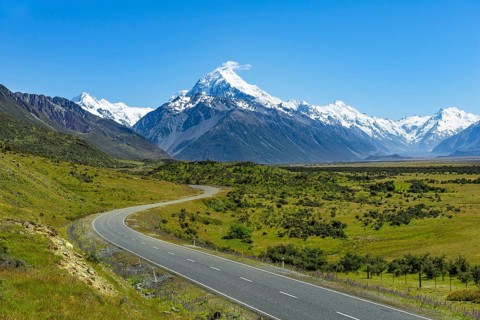 Country road overlooking snow-capped Mount Cook National Park
