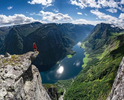 Hiker standing on rocky outcrop