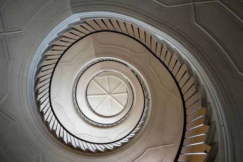 Beautiful winding staircase in old tenement house in Warsaw