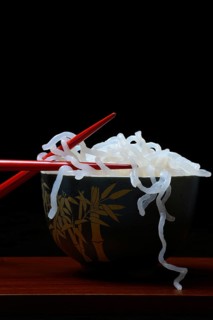 Shirataki noodles made from konjac flour in a bowl with chopsticks