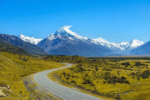 Country road overlooking snow-capped Mount Cook National Park