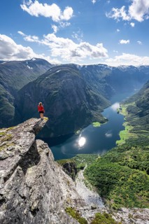 Hiker standing on rocky outcrop