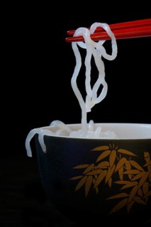 Shirataki noodles made from konjac flour on chopsticks