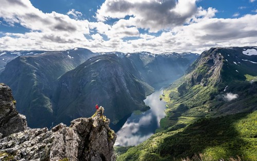 Hiker standing on rocky outcrop