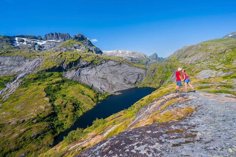 Hikers looking at mountain landscape