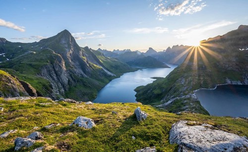 Sun shining over mountain landscape with fjord Forsfjorden and lake Krokvatnet