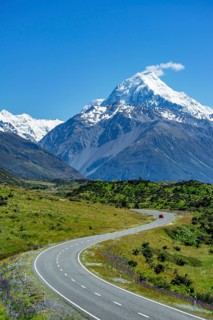 Country road overlooking snow-capped Mount Cook National Park