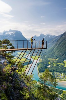 Hikers standing on viewing platform Rampestreken