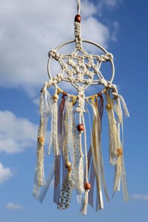 Dreamcatcher in front of blue sky