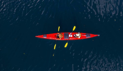 Red kayak in Geirangerfjord from above