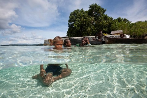 Children playing in lagoon