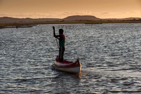 Fisherman with pirogue at the Manambolo