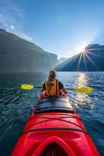 Young woman paddling in a kayak