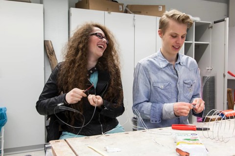 Students in the design class make a work of art with wire