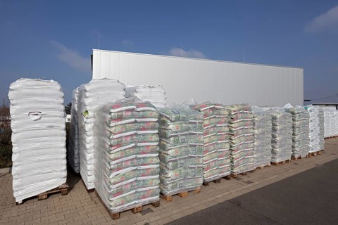 Stacked bags of potting soil and garden mulch for the spring shop