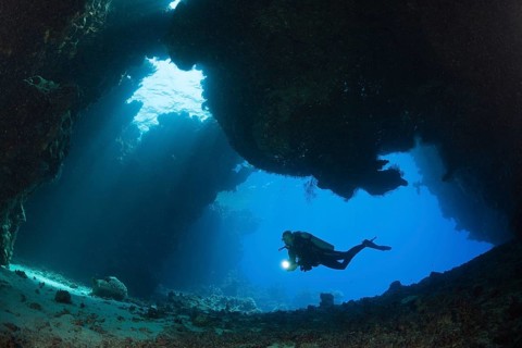 Diver in underwater cave