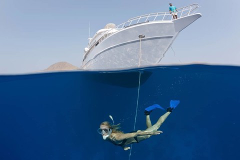 Snorkeling in front of safari ship