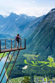 Hiker standing on viewing platform Rampestreken