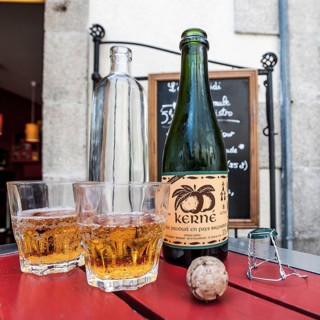 Cider bottle with glasses and a cork