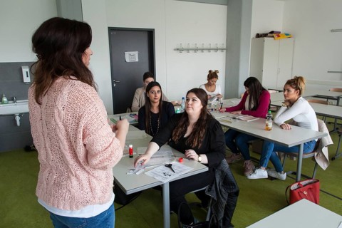 Vocational school students in class of the vocational training to become a beautician. Dual system at the Elly-Heuss-Knapp-Schule