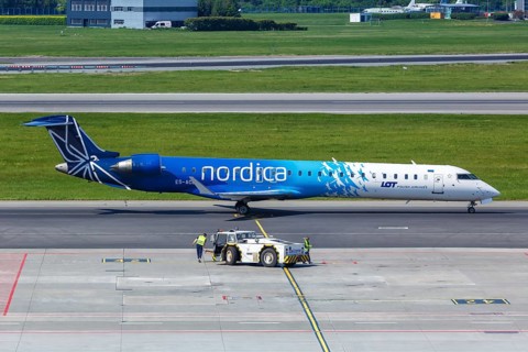 A Bombardier CRJ-900 aircraft of Nordica with registration number ES-ACB at Warsaw Airport