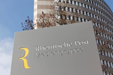 Logo Rheinische Post Mediengruppe in front of the Pressehaus Duesseldorf