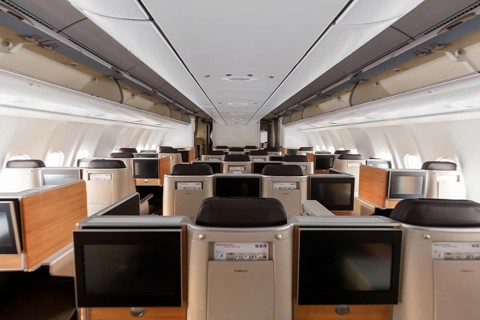 Business class cabin of an Airbus A340-300 aircraft of Swiss at Zurich airport