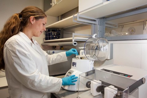 Scientist of biology at the homogenizer for RNA and DNA in the genetic engineering section of the laboratories of the University of Duisburg-Essen
