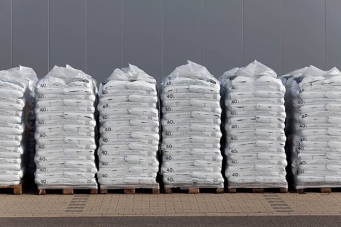 Stacked bags of potting soil and garden mulch for the spring shop