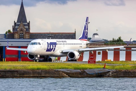 An Embraer 190 of LOT Polskie Linie Lotnicze with the registration SP-LMC at London City Airport