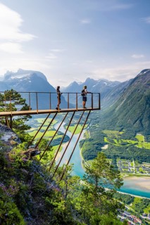 Hikers standing on viewing platform Rampestreken