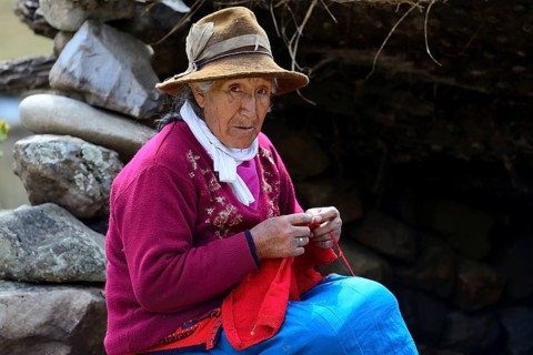 Indigenous old woman knitting