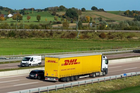 DHL truck driving on the A8 motorway near Jettingen