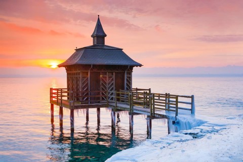 Iced bathhouse at sunrise