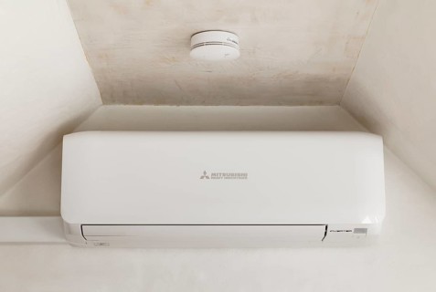 Split air conditioning system in the attic conversion of an old flat