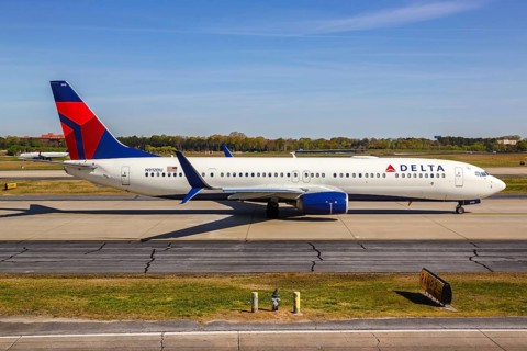 A Delta Air Lines Boeing 737-900ER aircraft with registration number N912DU takes off from Atlanta Airport