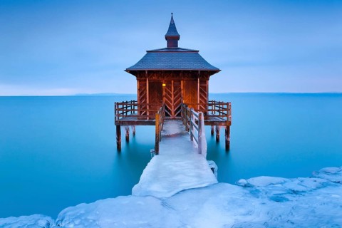 Iced bathhouse at dawn