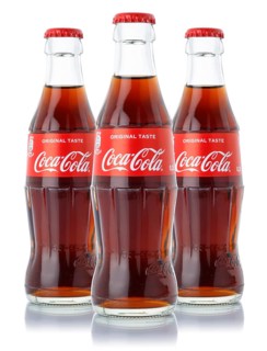 Coca Cola Coca-Cola soft drink beverage bottle cropped isolated against a white background in Germany