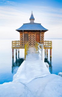 Iced bathhouse at dusk