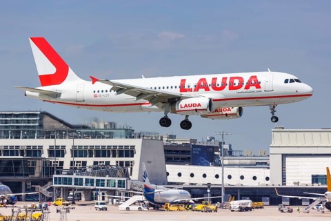 A Lauda Airbus A320 aircraft with registration number OE-LOY lands at Stuttgart Airport