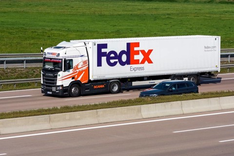 FedEx truck driving on the A8 motorway near Jettingen
