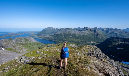 Hiker on the trail to the mountain Rundfjellet