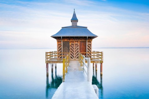 Iced bathhouse at dusk