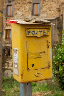 Old french metal postbox in countryside