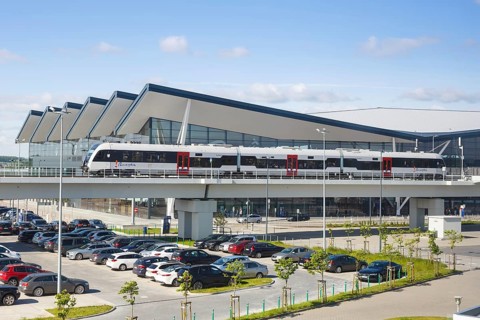 Regional train in front of the terminal of Gdansk Lech Walesa Airport Gdansk